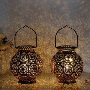 Set of 2 Moroccan style metal table lanterns, battery operated, warm glow through intricate perforations