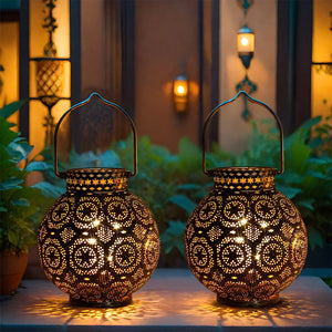 Set of 2 JHY DESIGN Moroccan-style metal table lamps battery-operated with intricate perforated patterns and warm light.