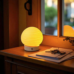 Ceramic Ball Rechargeable Lamp Planet by JHY DESIGN; cordless table lamp with warm yellow glow