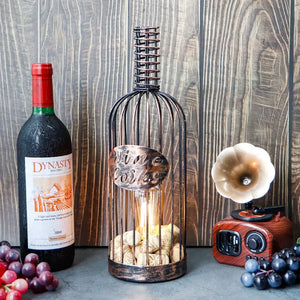 Cordless metal wine cork holder lamp with copper-toned cage, 13.5 inches tall and corks visible at the base.