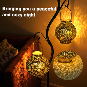Set of 2 Moroccan-style metal battery-operated table lamps with intricate cutout patterns by JHY DESIGN.