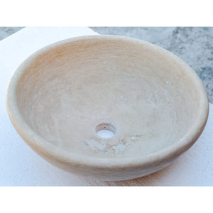 Beige travertine vessel sink, round above-vanity bowl with central drain hole, honed and filled, 16-inch diameter
