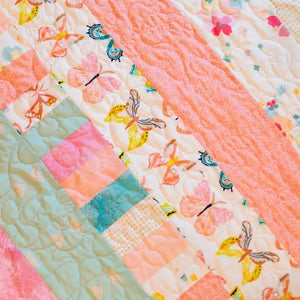 Bricks and Beams Quilt Kit - Butterflies, pastel fabric strips with butterfly print in mint, peach, pink.