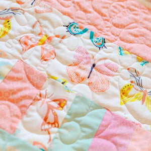 Bricks and Beams Quilt Kit - Butterflies; pastel pink, peach and mint blocks with butterfly prints