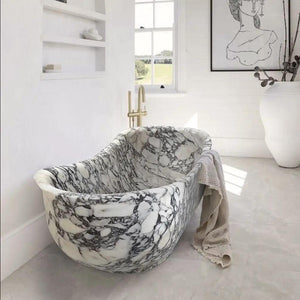 Calacatta Viola freestanding marble bathtub by Villohome, white with gray veining; 34W x 70L x 26H