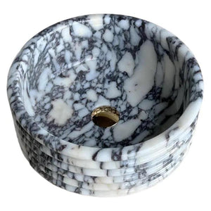 Calacatta Viola marble fluted round bathroom sink by Villohome, polished white with dark gray veining, brass drain.