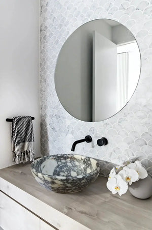 Calacatta Viola Marble above-vanity bathroom sink by Villohome, round marble vessel with gray veining.