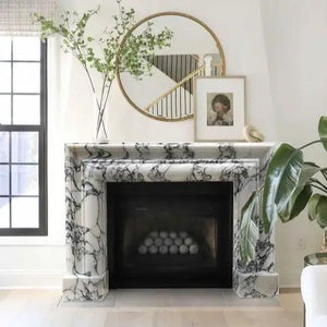 Calacatta Viola marble fireplace mantel by Villohome, polished and hand-carved, 61 in long, with round mirror.