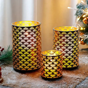 Metal hurricane lanterns set of 3 by JHY DESIGN, decorative candle holders with cutout fan pattern and warm gold glow.