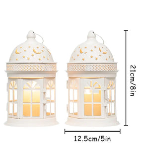 White decorative lanterns set of 2, 8.5 inches tall with moon and star cutouts and warm interior light