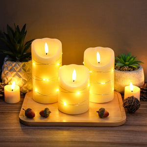 Set of 3 flickering flameless real-wax LED candles in ivory with a warm glow