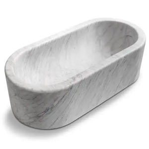 Imperial White Marble Bathtub, hand-carved from solid marble block, freestanding oval tub.