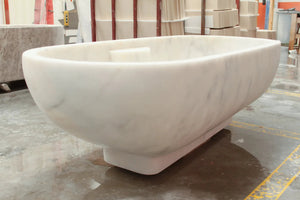 Bianco Carrara white marble bathtub by Villohome, hand-carved, freestanding.