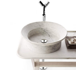 Villohome marble above-counter vessel sink, white marble, 20in dia by 6in high, on white vanity with chrome faucet.