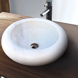Natural Carrara White marble above-counter bathroom sink with chrome faucet
