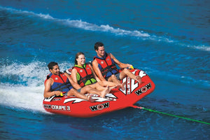 WOW Watersports 3-Person Coupe Cockpit Towable, red inflatable with WOW logos, three riders wearing life jackets.