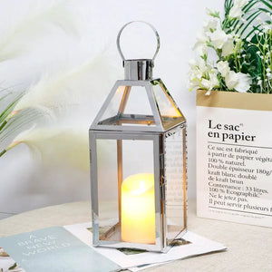 16-inch high decorative lantern by JHY DESIGN, rose gold metal frame with glass panels.