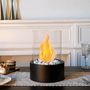 Extra-large tabletop bio-ethanol fire bowl with black base, clear glass dome and white pebbles