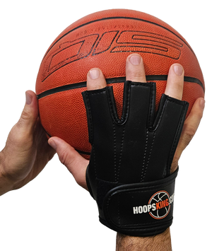 Perfect Jump Shot Glove by HoopsKing on a hand gripping an orange basketball; black basketball shooting glove