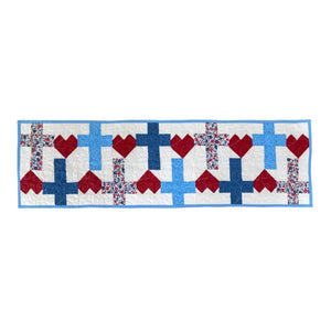 Quilt kit table runner God Bless America crosses and hearts by Block Party Quilt Co in red and blue floral prints.