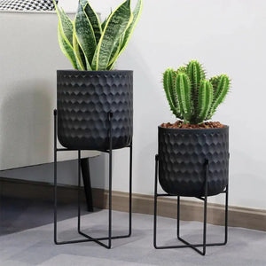 Flower pots set: 2 black metal pots with stands, textured hammered finish, 12" and 18" heights.
