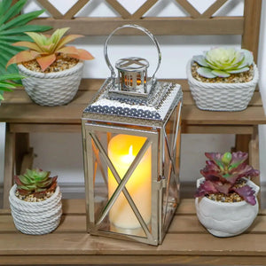 14-inch square stainless steel decorative candle lantern by JHY DESIGN with a warm glow