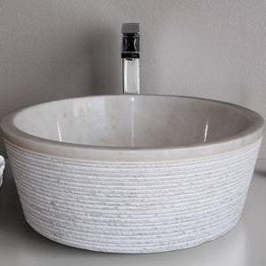 European Sugar Marble tapered vessel bathroom sink in white with ribbed exterior and chrome faucet