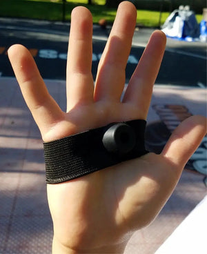 No Palm Dribbling & Shooting Palm Aid strap on hand; black palm guard with circular knob
