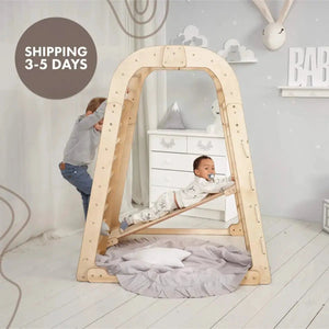 Goodevas 6in1 indoor wooden playset with arch frame; two kids climb and slide on natural wood