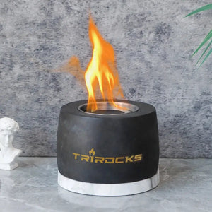 Black graphite cement portable fireplace with flame and Trirocks logo