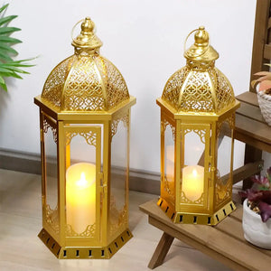 Set of 2 gold vintage metal candle lanterns, 22-inch and 17-inch tall, with glass panels.