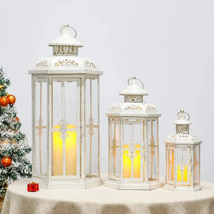 Set of 3 white metal candle lanterns with gold brush accents in 20in, 14in, and 10in sizes