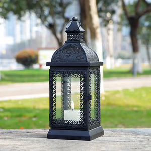 13-inch black rustic metal candle lantern with ornate lattice panels and glass panes
