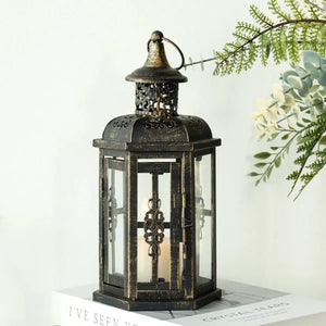 JHY DESIGN decorative candle lantern, 12-inch tall black metal with antique gold brush finish and glass panels.
