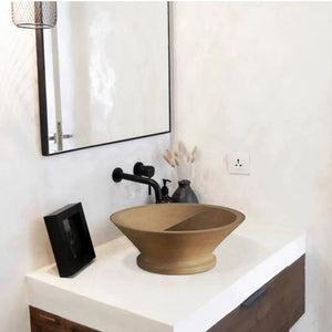 Light beige travertine vessel sink honed finish by Villohome on white vanity with black faucet
