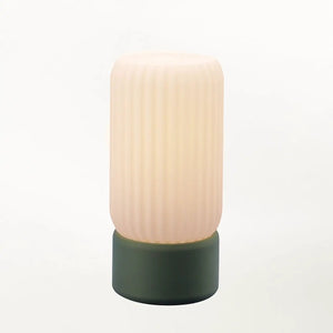 Milk Shade Barrel Table Lamp by Terra Labs; pale ribbed shade atop a dark green base
