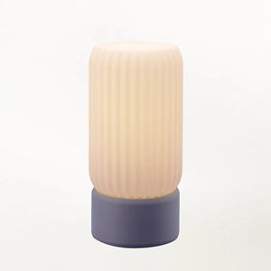 Milk Shade Barrel Table Lamp with milk-white ribbed shade and navy base.
