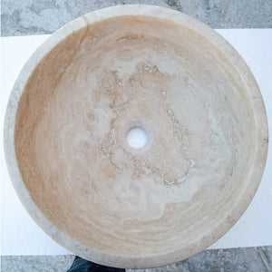 Beige travertine above-vanity bathroom vessel sink; round, honed and filled, 18-inch diameter.
