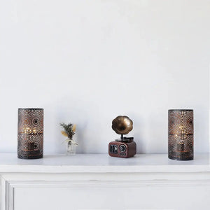 Set of 2 black metal battery-operated table lamps with intricate perforated lattice pattern.