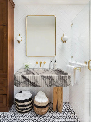 New York Marble wall-mount vessel sink by Villohome, ribbed textured white-gray marble with gold fixtures