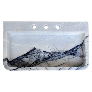 New York Marble wall-mount bathroom sink with fluted front and edges; white with dark veining.