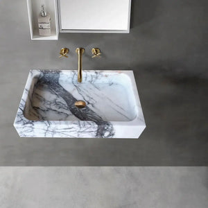 New York Marble rectangular wall-mount bathroom sink in polished white with gray veining and brass faucet.