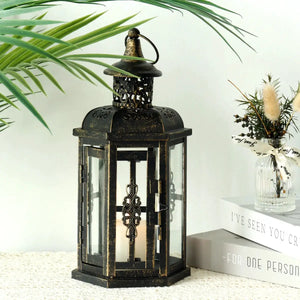 12H decorative metal candle lantern, black with gold brush finish, glass panels.