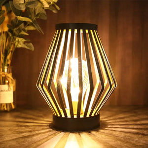 Diamond-shaped battery-powered table lamp; black metal frame with warm glow by JHY DESIGN.