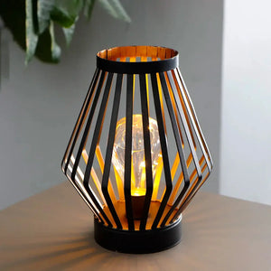 8.7in tall battery-powered table lamp Diamond, black geometric metal cage around a warm glowing bulb
