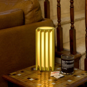 Radiator table lamp Terra Labs, yellow-green geometric slat frame with warm glow.