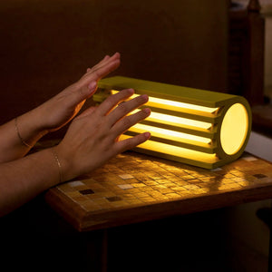 Radiator Table Lamp by Terra Labs; yellow metal finish with warm glow