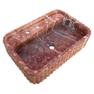 Red travertine wall-mount bathroom sink by Villohome; ribbed textured exterior, single basin