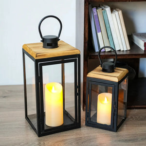 Set of 2 JHY DESIGN decorative candle lanterns, 16in and 11in, black metal frames with glass panels.