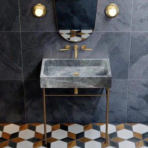 Sirius gray marble rectangular bathroom sink above vanity with gold metal stand and brass fixtures
